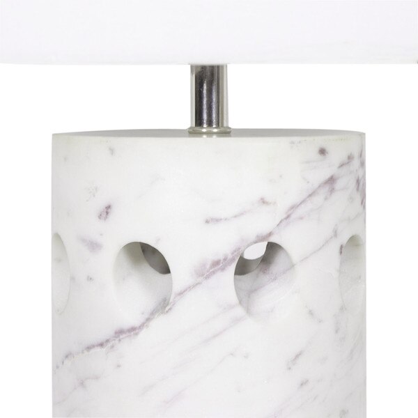 Base of a white marble table lamp with holes around it
